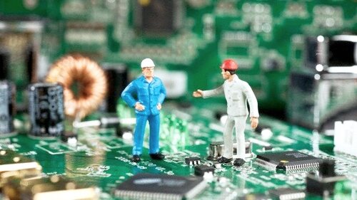 Quality engineer reviewing process nonconformances on a manufacturing floor