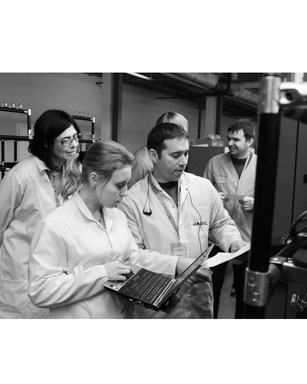 Quality consultant reviewing documents and processes on-site